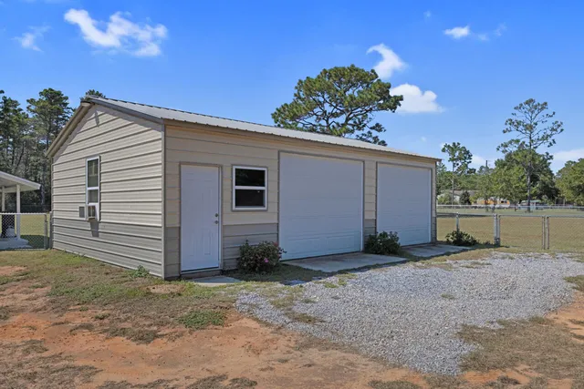a view of a house with a backyard