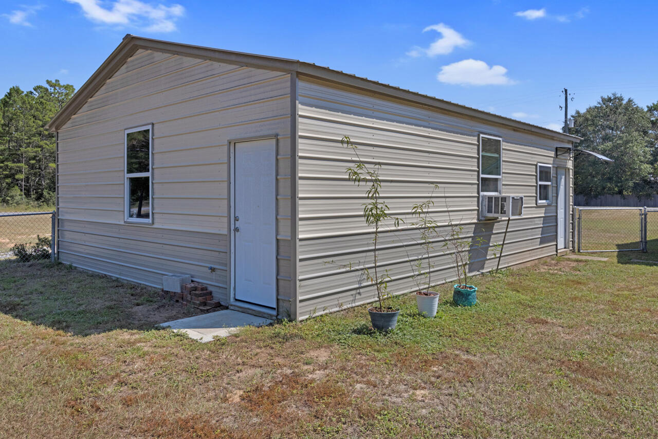 5448 Mt Olive Road Crestview, FL 32539 - Photo 31 of 37 a view of a house with backyard