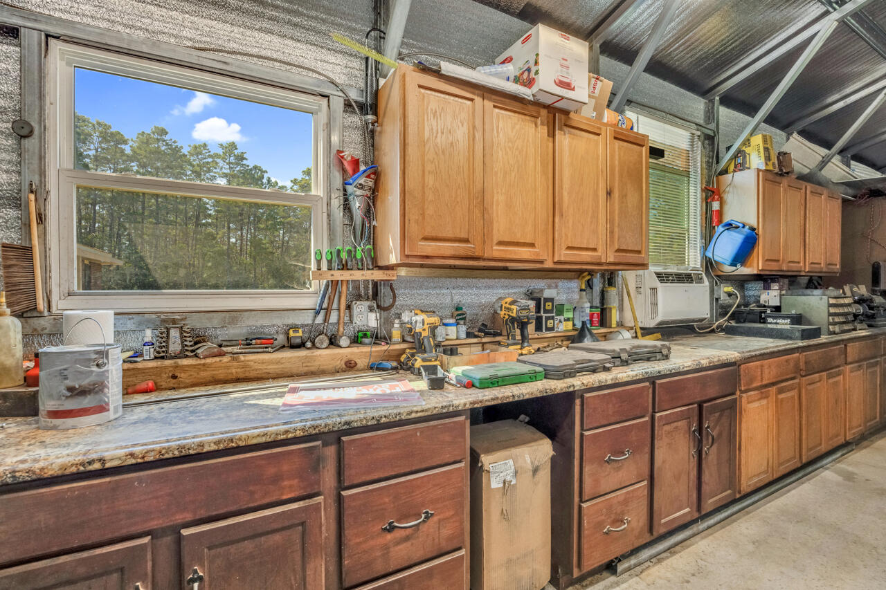 5448 Mt Olive Road Crestview, FL 32539 - Photo 33 of 37 a kitchen with sink a window and cabinets