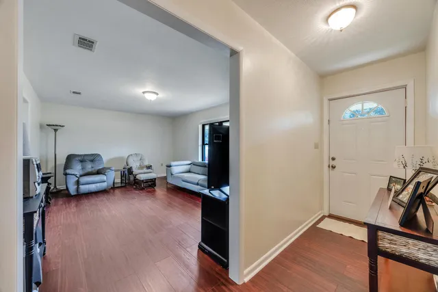 a view of a room with gym equipment and a window