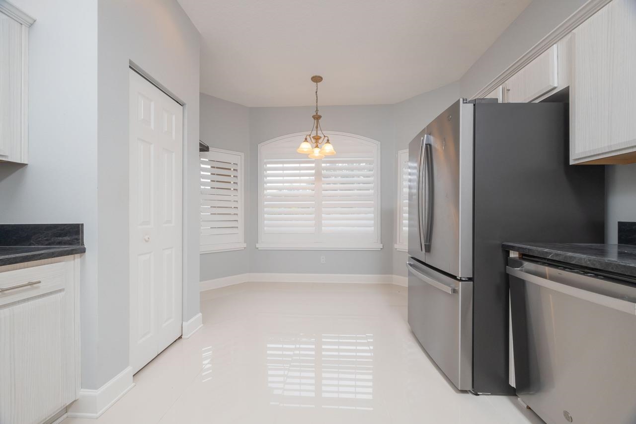 573 Boxwood Place St. Augustine, FL 32086 - Photo 17 of 40 a view of kitchen with refrigerator and window