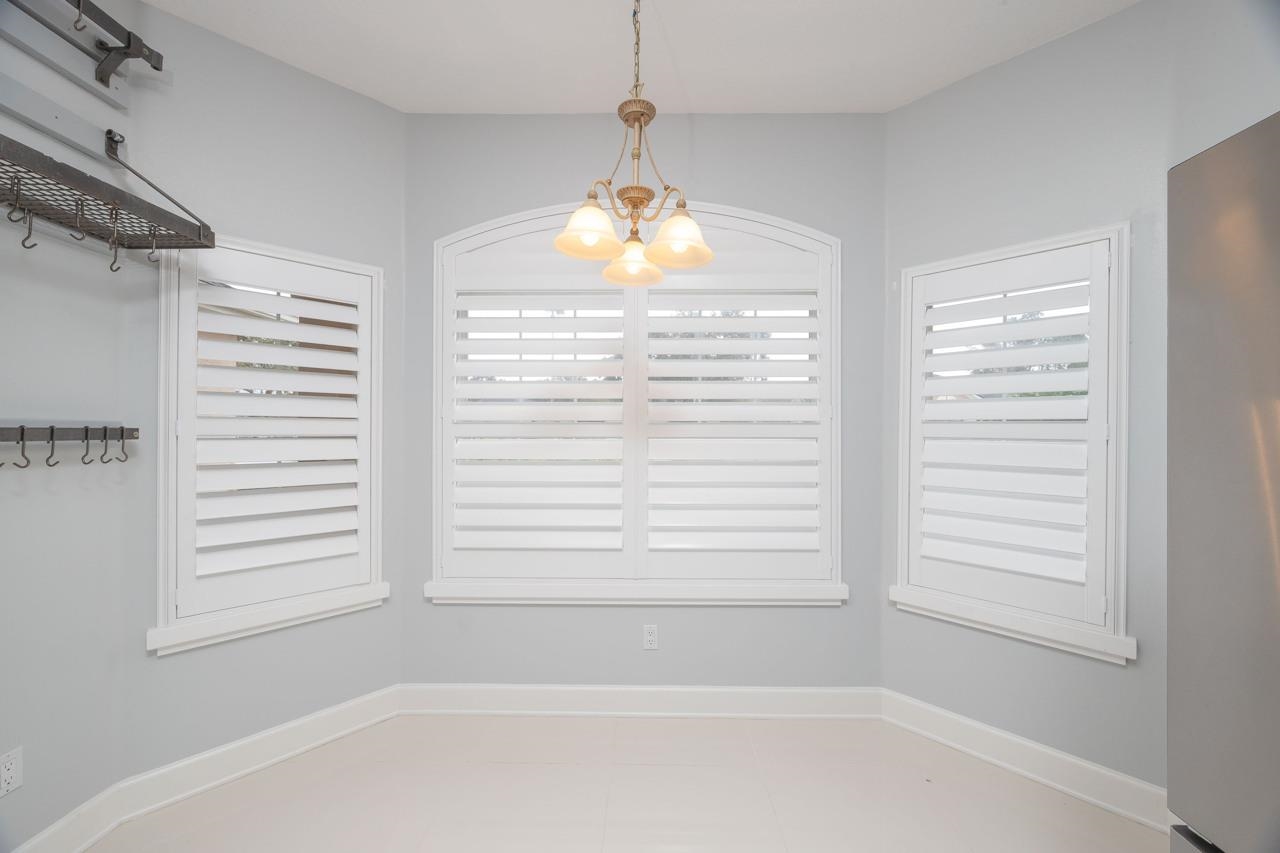 573 Boxwood Place St. Augustine, FL 32086 - Photo 18 of 40 a bathroom with a window and a shower