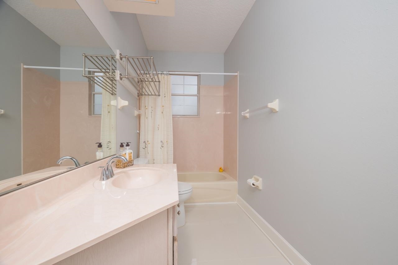 573 Boxwood Place St. Augustine, FL 32086 - Photo 38 of 40 a bathroom with a sink and a mirror