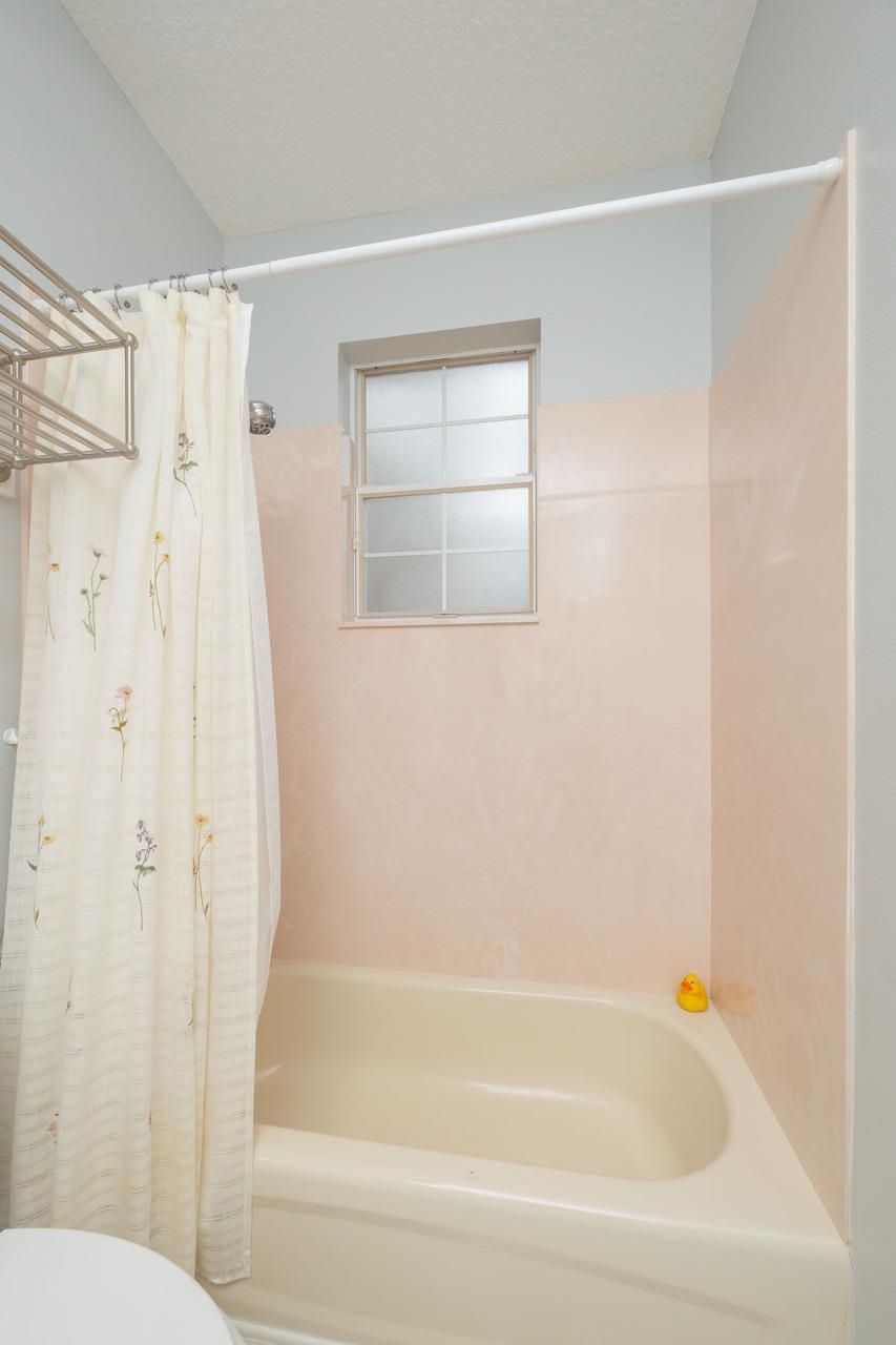 573 Boxwood Place St. Augustine, FL 32086 - Photo 39 of 40 a bathroom with a bathtub and a shower