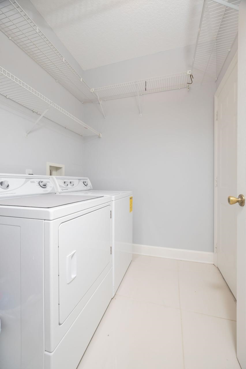 573 Boxwood Place St. Augustine, FL 32086 - Photo 40 of 40 a utility room with dryer and washer