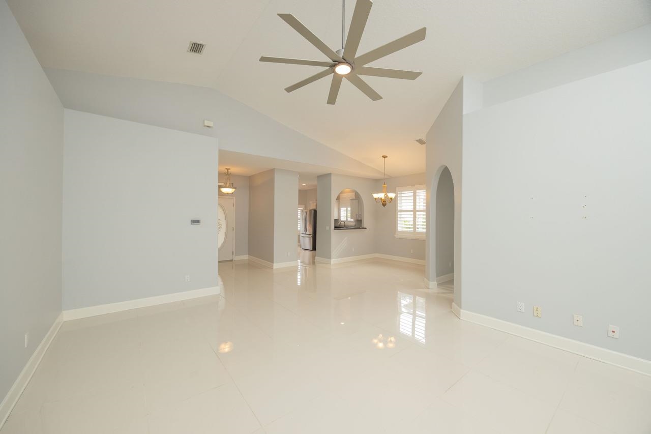 573 Boxwood Place St. Augustine, FL 32086 - Photo 9 of 40 wooden floor in an empty room with a window
