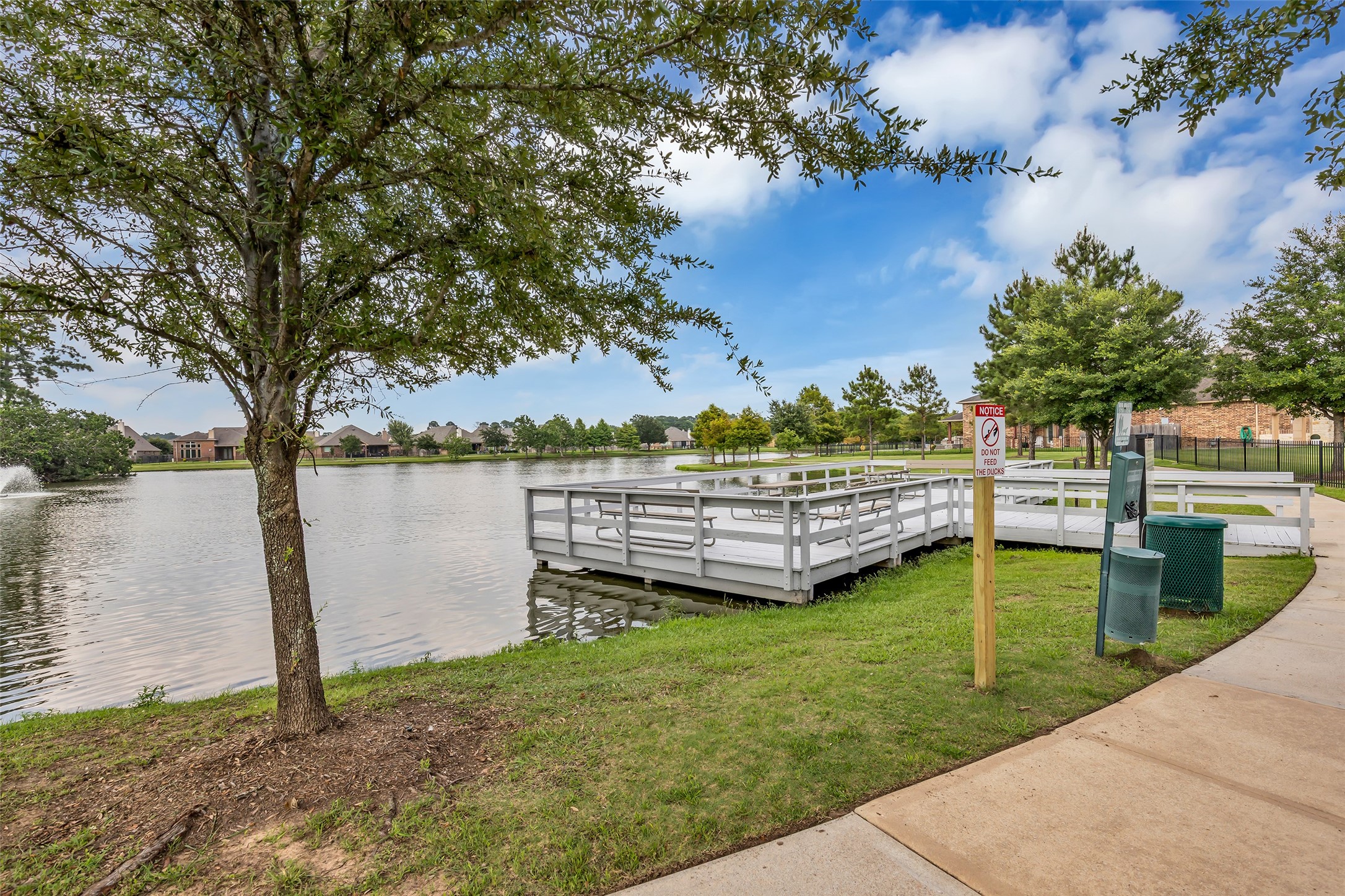 22907 Banff Brook Way Tomball, TX 77375 - Photo 24 of 26 The lake is part of the neighborhood amenities and features a private dock available for community use.