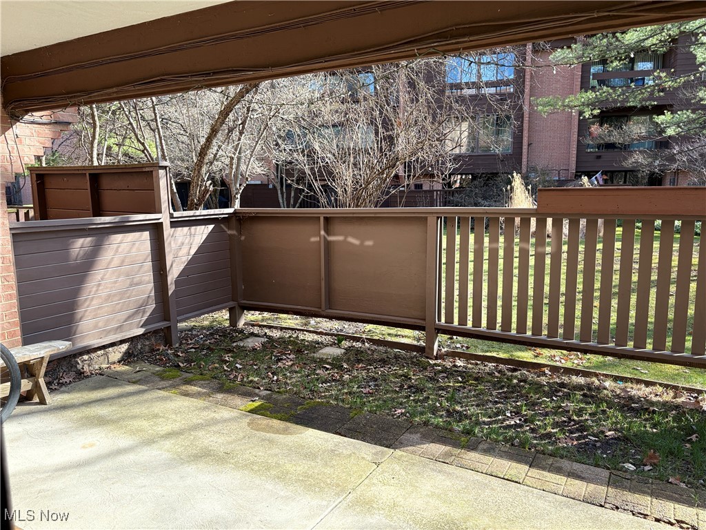 935 Canyon View Road, Unit 104 Northfield, OH 44067 - Photo 33 of 46 View of patio with fence