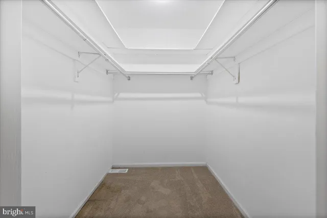 a view of an empty walk in closet