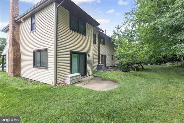 a view of a backyard with plants and a backyard