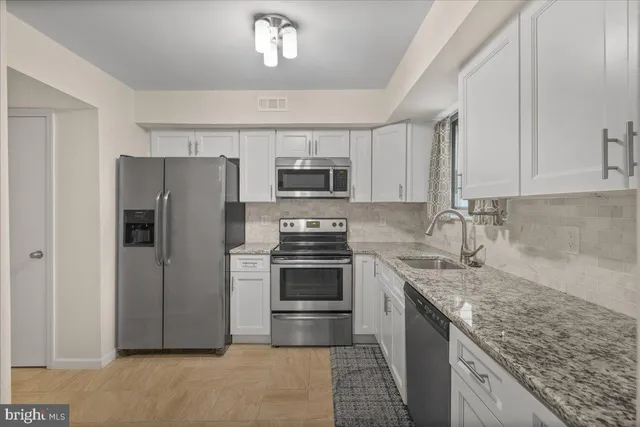 a kitchen with a stove microwave and refrigerator