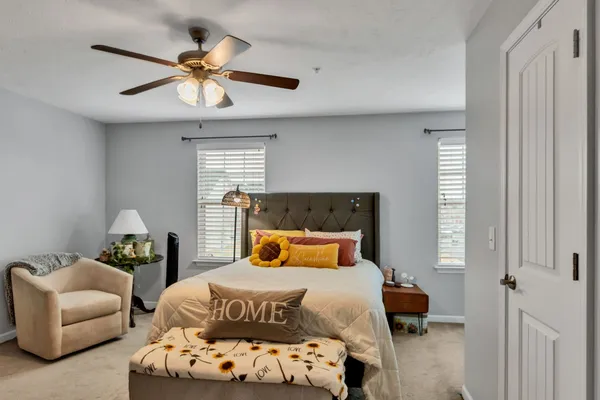 a bedroom with a bed and window