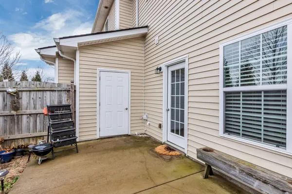 a view of a house with a door and a couch