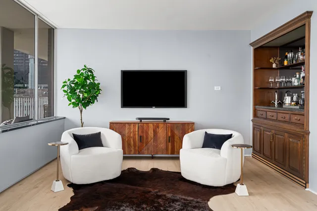 a kitchen with stainless steel appliances granite countertop a kitchen island a stove a refrigerator and a sink