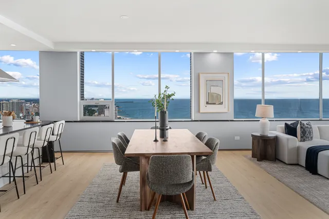 a kitchen with stainless steel appliances granite countertop a sink a stove and a refrigerator