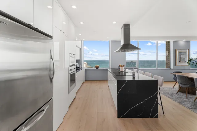 a living room with furniture potted plant and a window