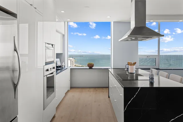 a kitchen with a refrigerator and a sink