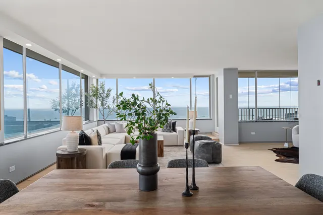 a spacious bedroom with a bed and a couch