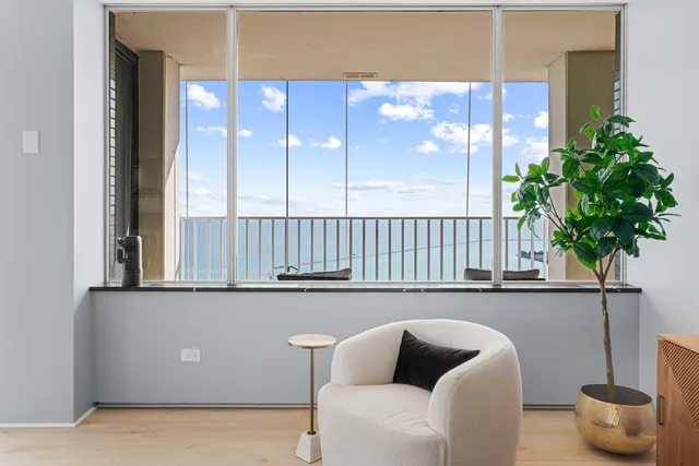 a bedroom with a bed couch and a window