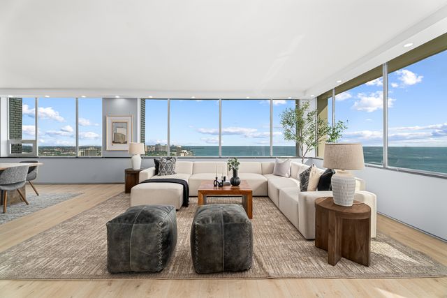a living room with furniture and flat screen tv
