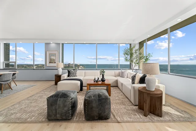 a living room with furniture and flat screen tv