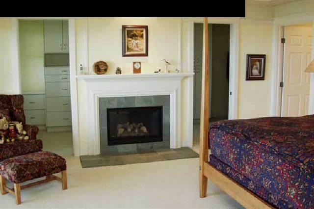 155 Pulehu Road Kula, HI 96790 - Photo 3 of 18 a living room with a couch and a fireplace