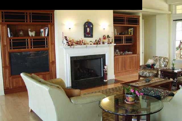 155 Pulehu Road Kula, HI 96790 - Photo 6 of 18 a living room with furniture and a fireplace