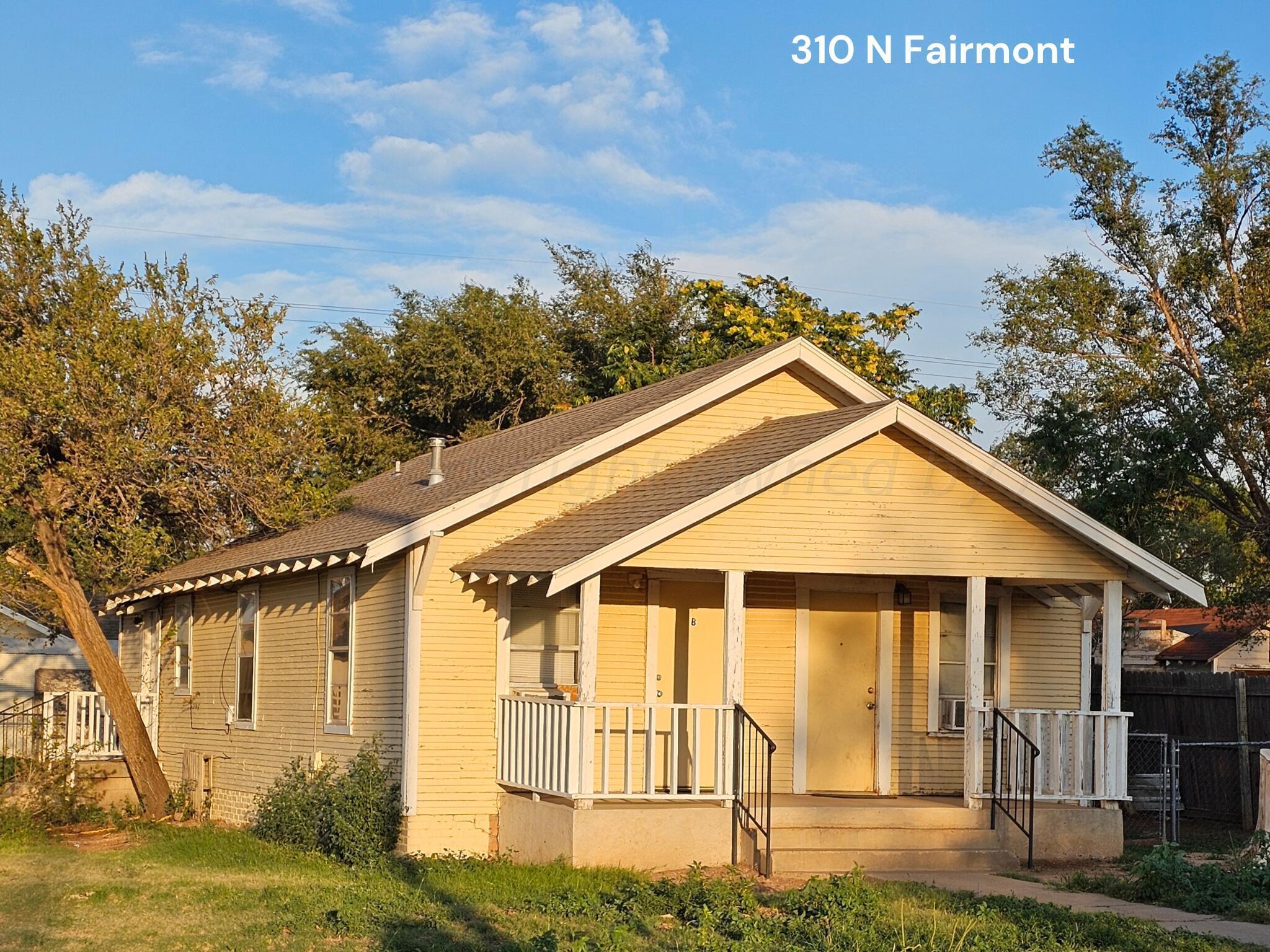 Amarillo Investments Portfolio Amarillo, TX 79106 - Photo 15 of 22 a front view of a house with a yard