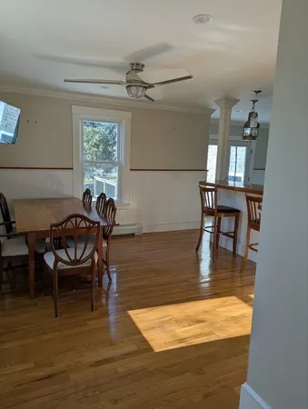 a living room with furniture a window and a table