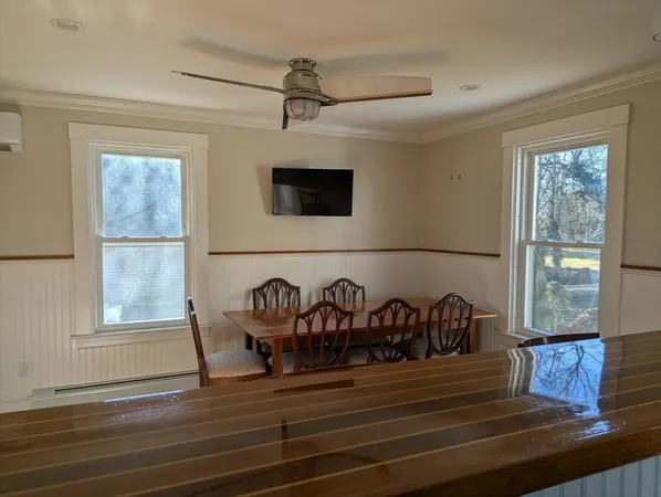 a view of entryway wooden floor and front door