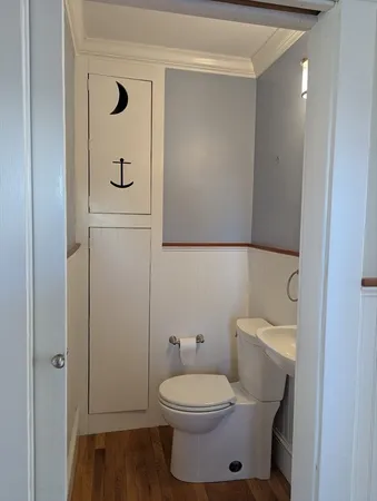 a bathroom with a toilet and a sink