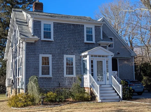 a front view of a house with stairs