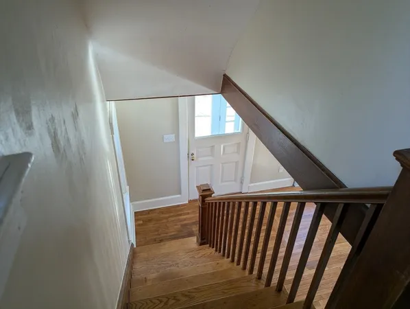 a view of a hallway with staircase