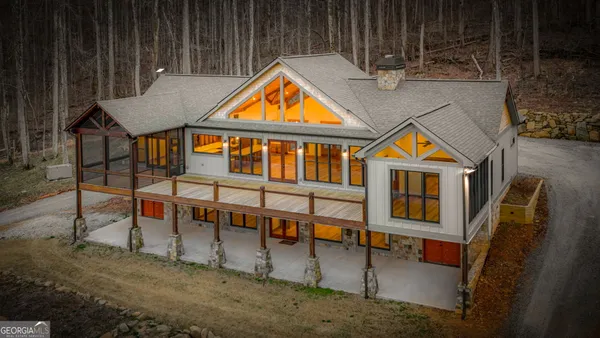 an aerial view of a house with swimming pool