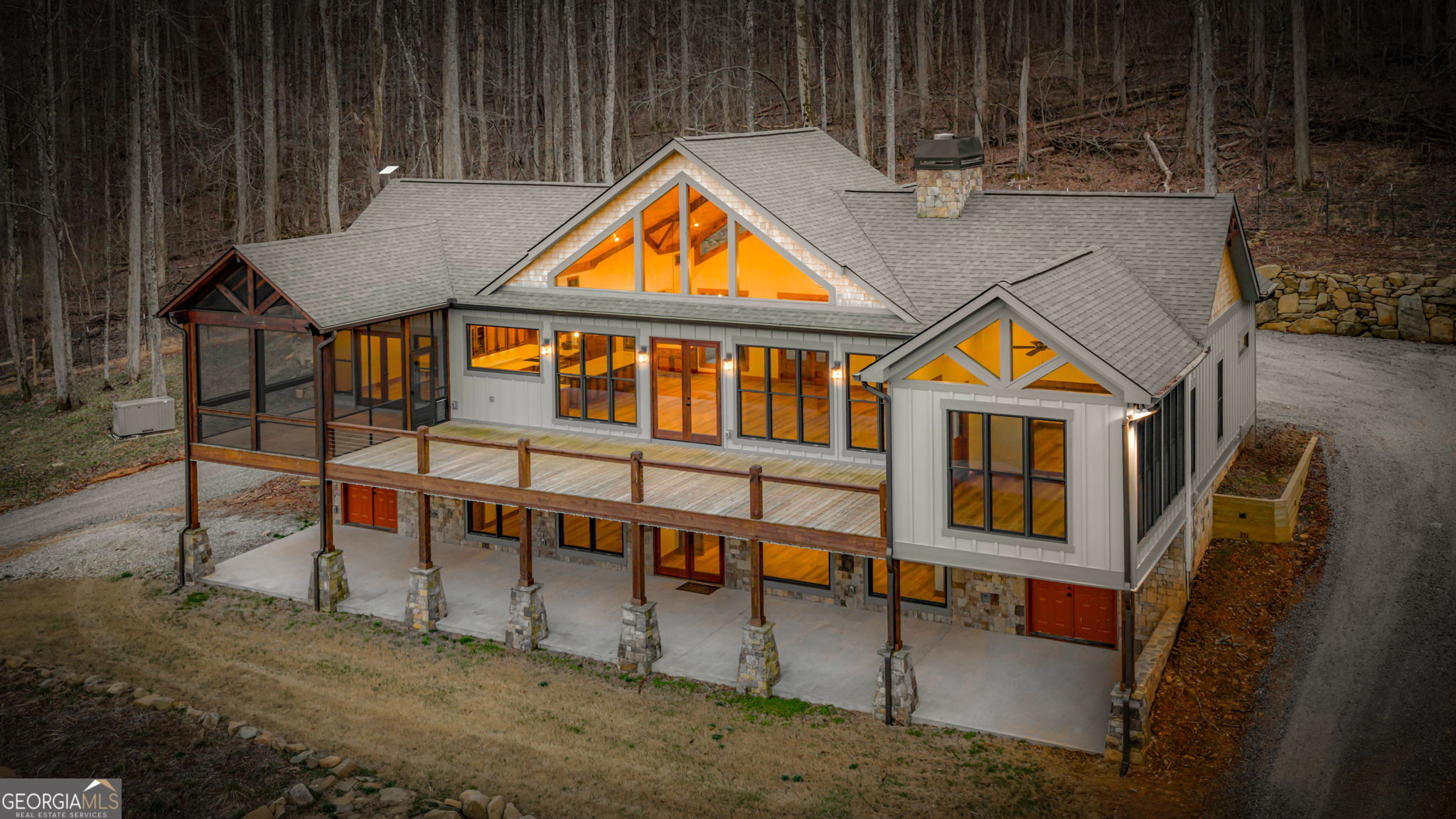 an aerial view of a house with swimming pool