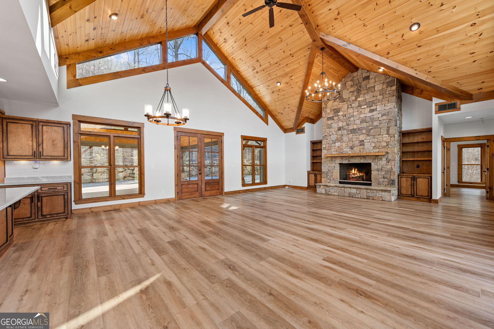 120 Cohutta Ranch Road Blue Ridge, GA 30513 - Photo 43 of 90 a view of an empty room with wooden floor fireplace and a window