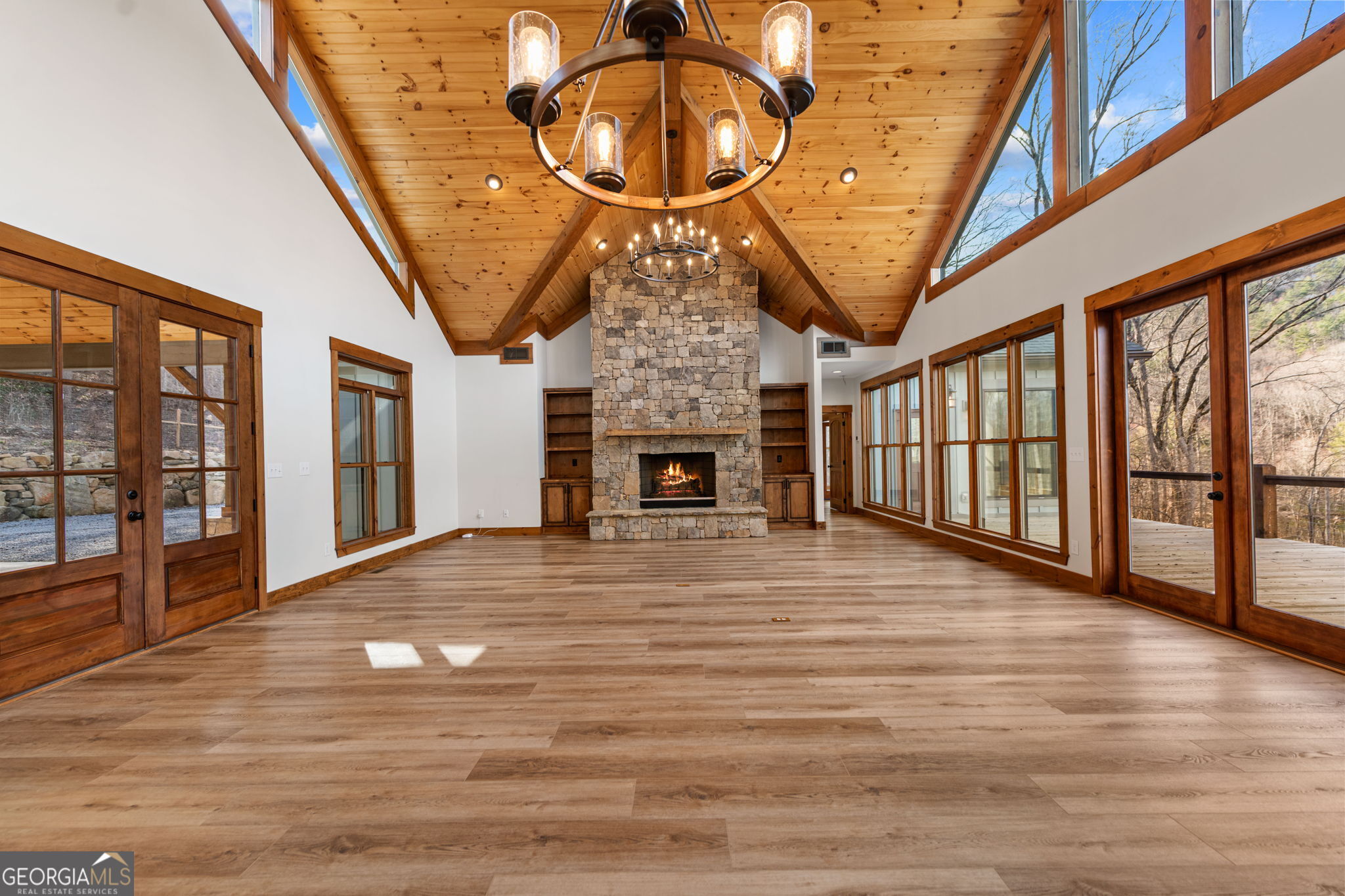 120 Cohutta Ranch Road Blue Ridge, GA 30513 - Photo 44 of 90 a view of an empty room with wooden floor and a fireplace