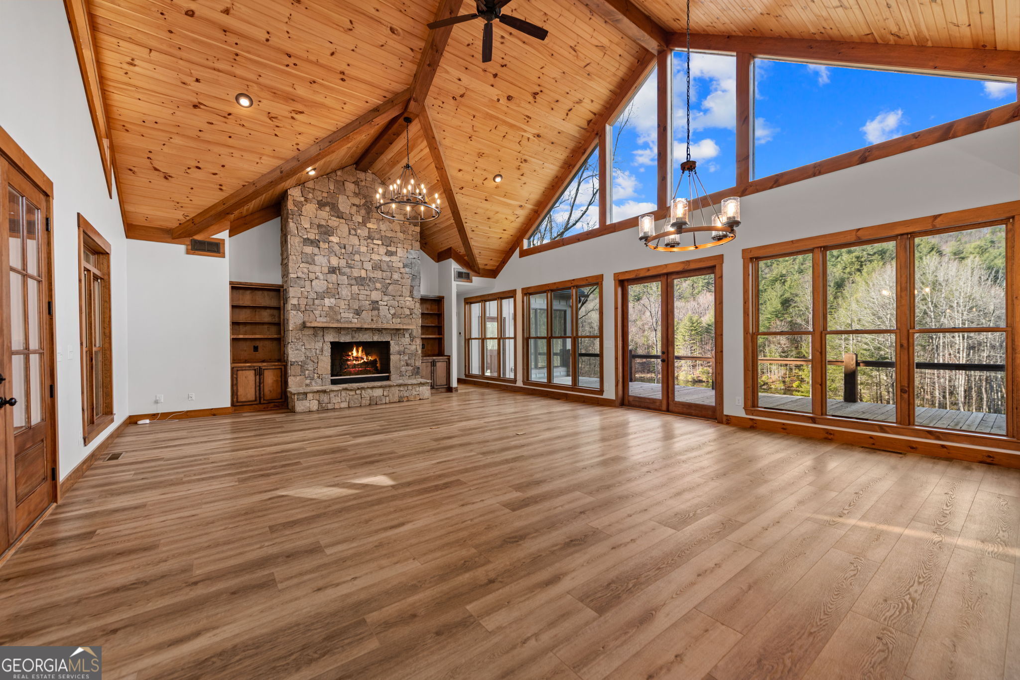 120 Cohutta Ranch Road Blue Ridge, GA 30513 - Photo 46 of 90 a view of an empty room with wooden floor and a fireplace