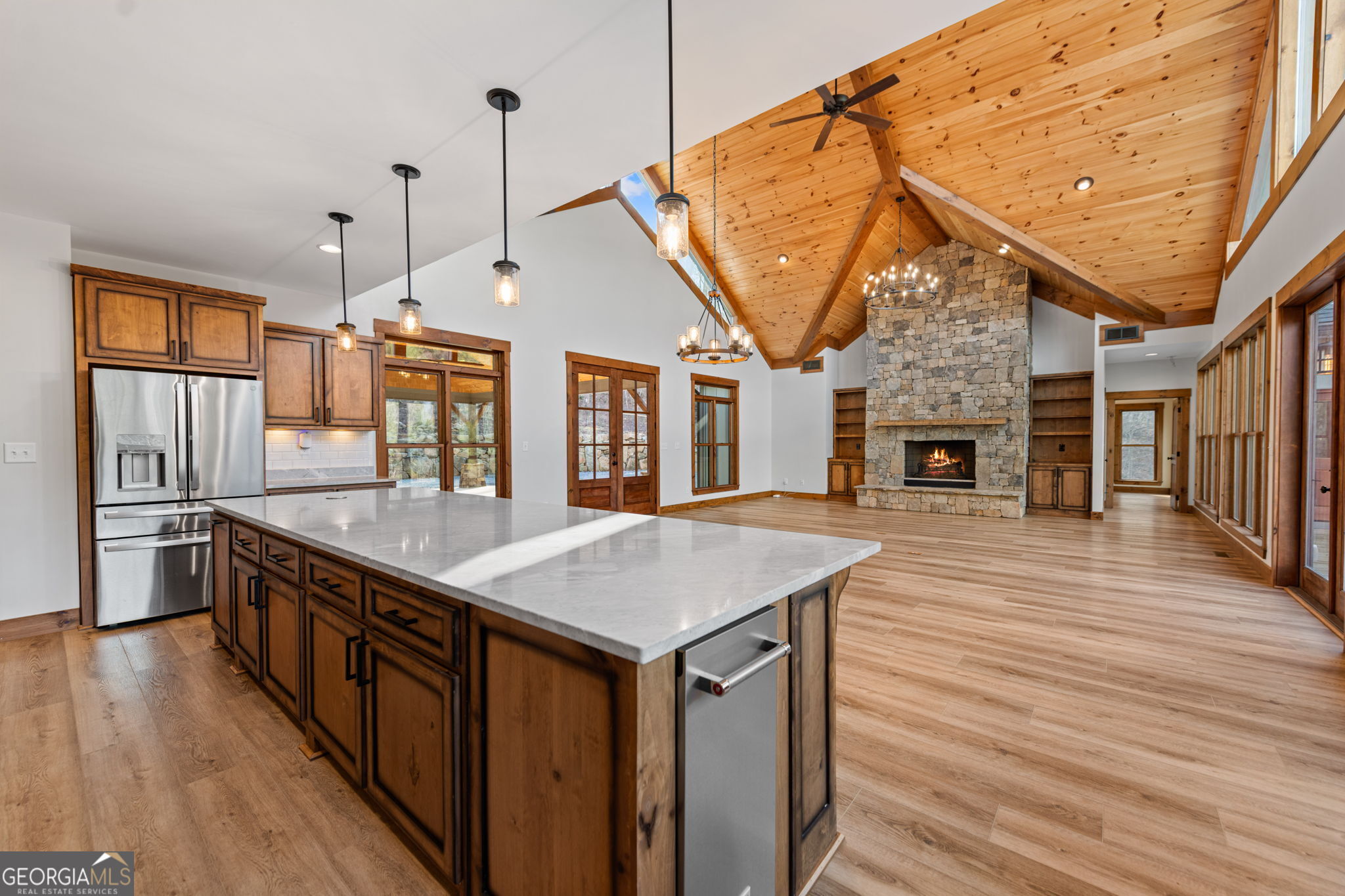 120 Cohutta Ranch Road Blue Ridge, GA 30513 - Photo 50 of 90 a open kitchen with stainless steel appliances granite countertop a kitchen island a stove a refrigerator a oven and a wooden floors