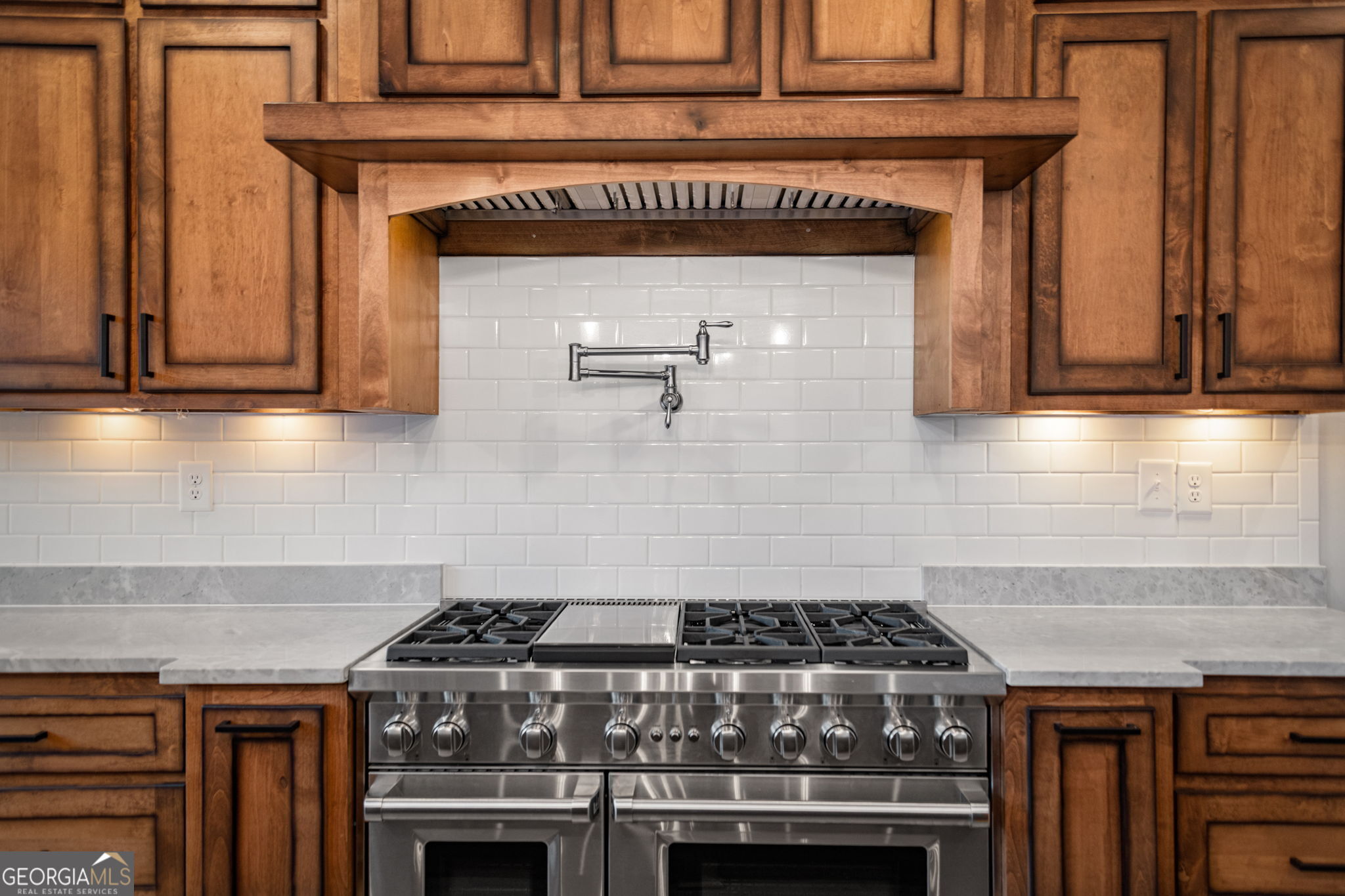 120 Cohutta Ranch Road Blue Ridge, GA 30513 - Photo 53 of 90 a stove top oven sitting inside of a kitchen
