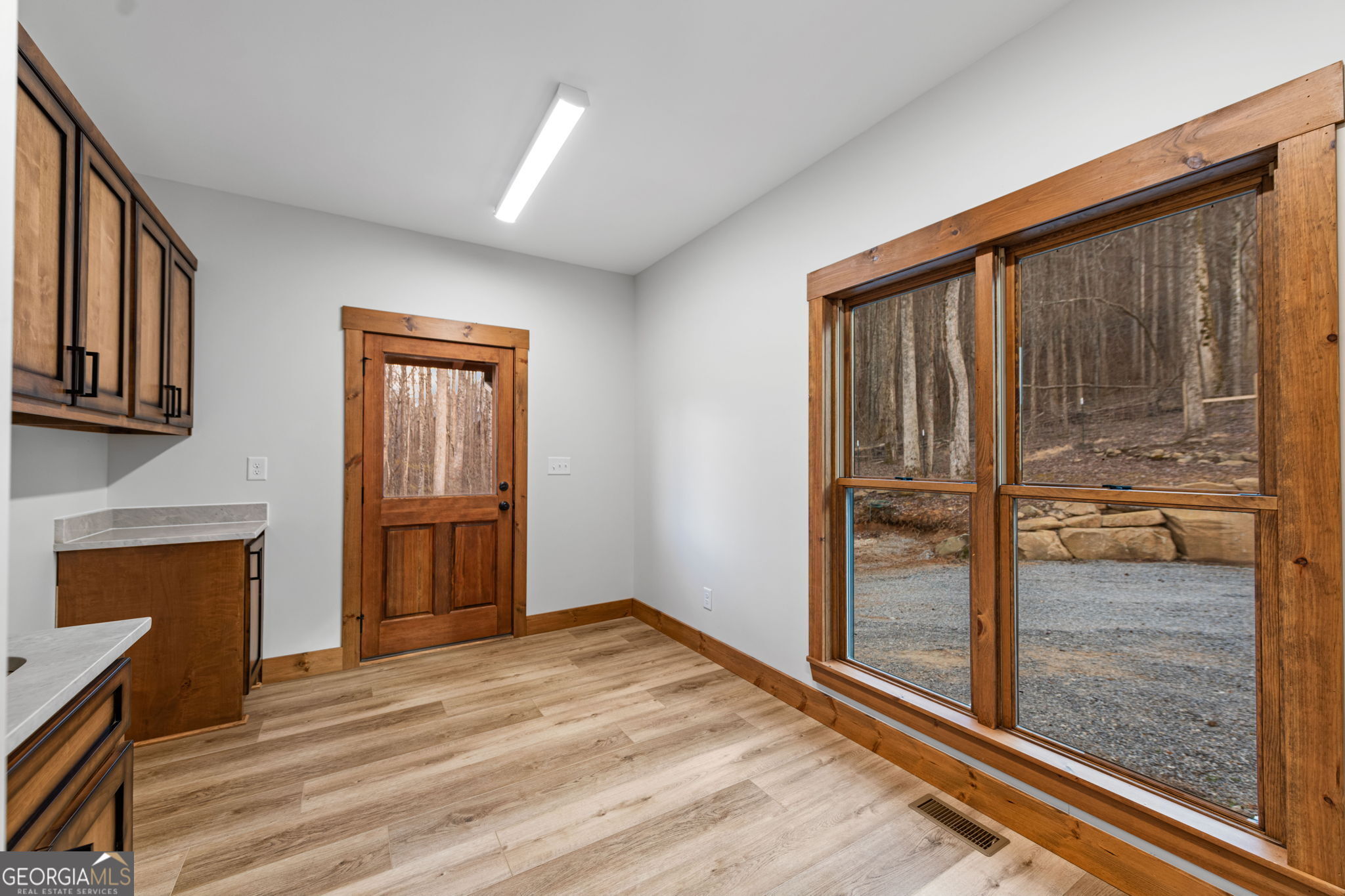 120 Cohutta Ranch Road Blue Ridge, GA 30513 - Photo 54 of 90 a view of a room with wooden floor and a fireplace