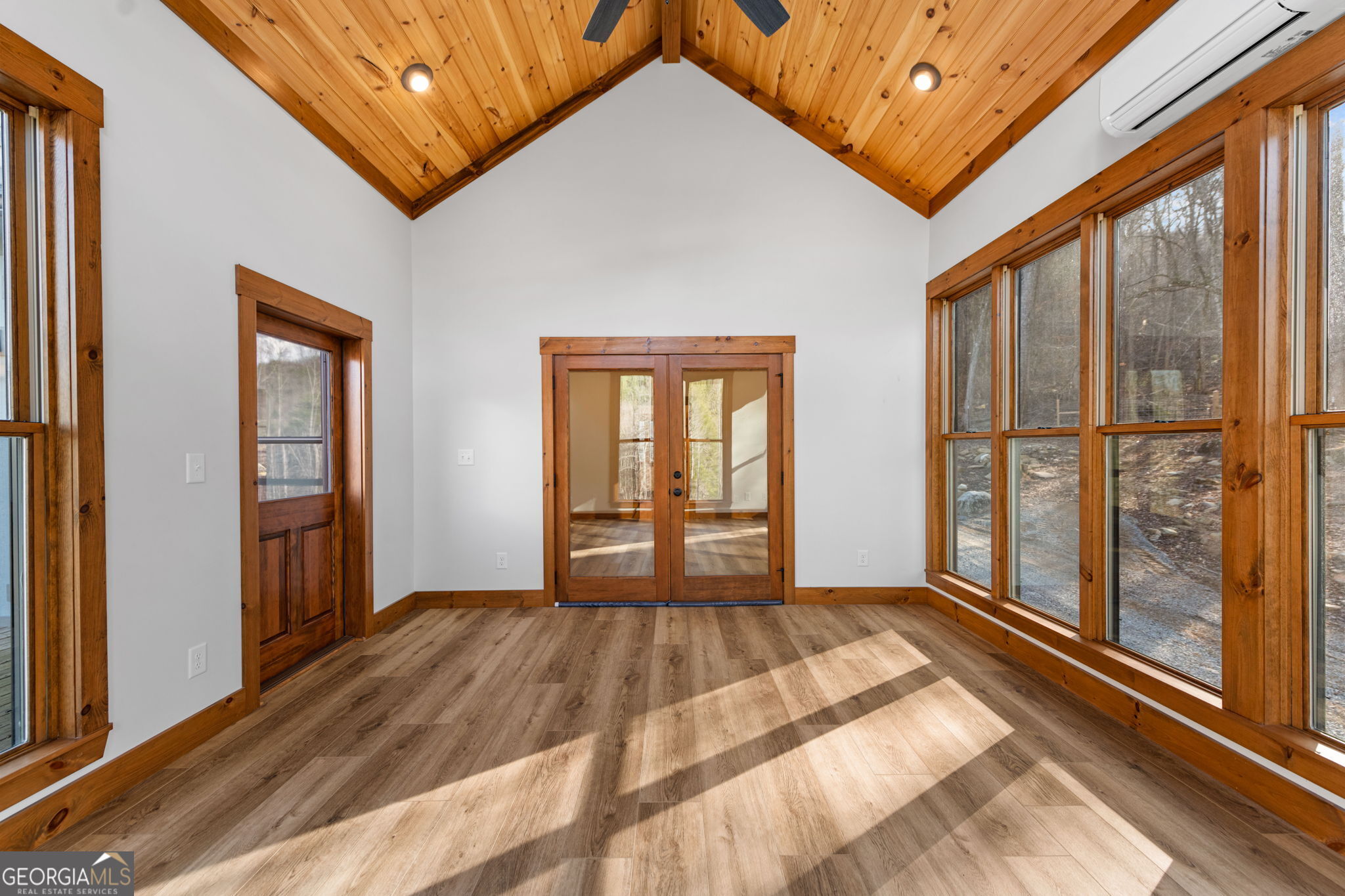 120 Cohutta Ranch Road Blue Ridge, GA 30513 - Photo 62 of 90 a view of an empty room with wooden floor and a window