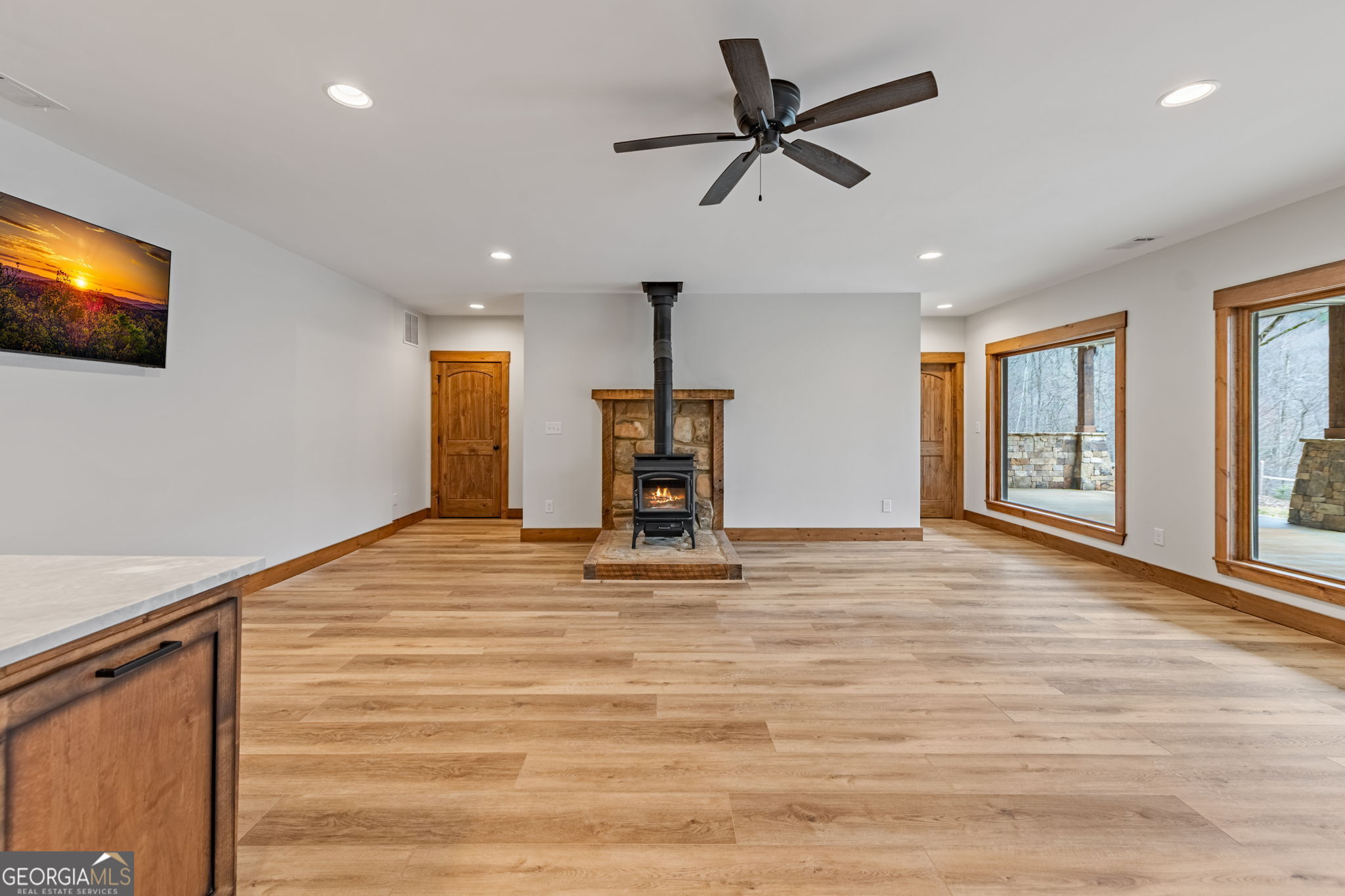 120 Cohutta Ranch Road Blue Ridge, GA 30513 - Photo 68 of 90 a view of a livingroom with a ceiling fan window and wooden floor
