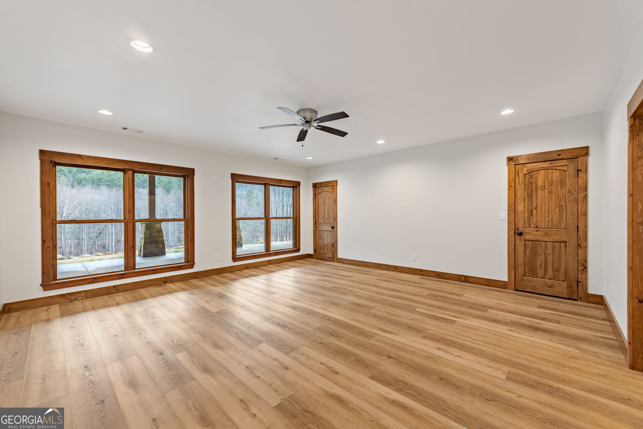 120 Cohutta Ranch Road Blue Ridge, GA 30513 - Photo 74 of 90 a view of an empty room with a window and wooden floor