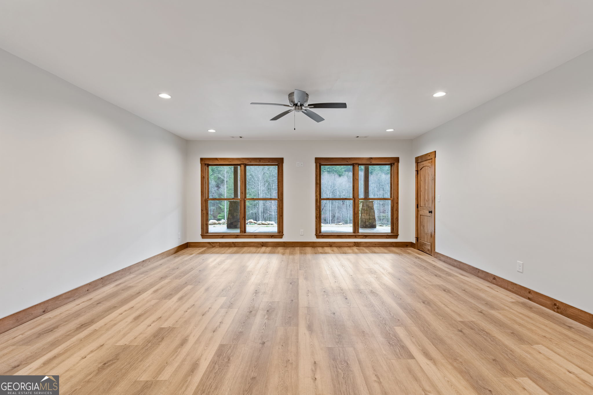 120 Cohutta Ranch Road Blue Ridge, GA 30513 - Photo 75 of 90 a view of an empty room with a window and wooden floor