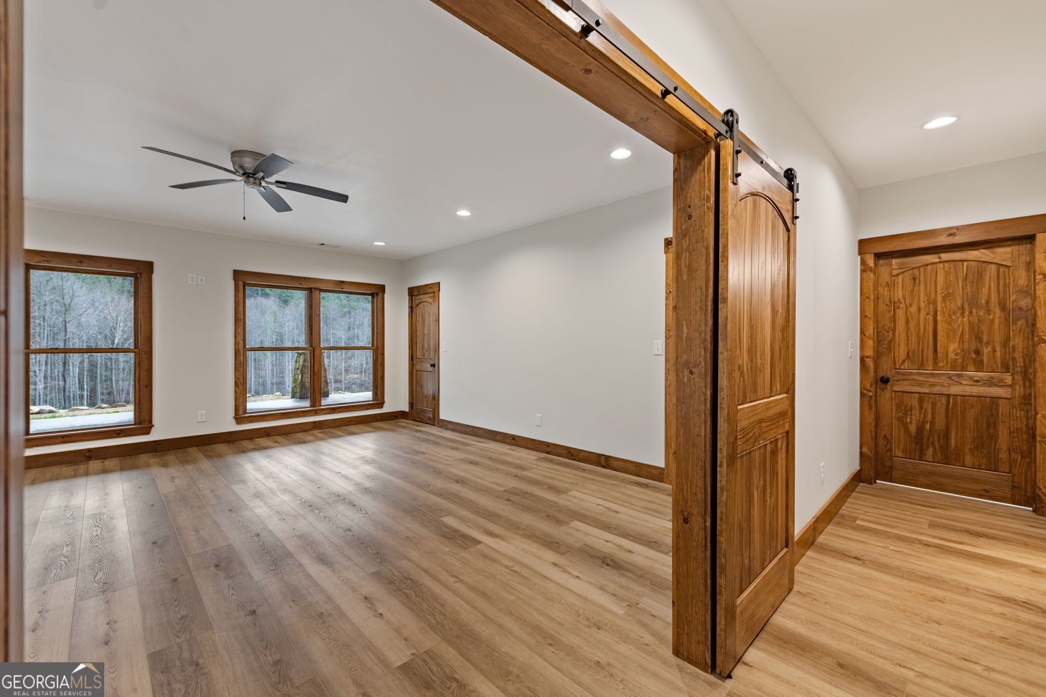 120 Cohutta Ranch Road Blue Ridge, GA 30513 - Photo 76 of 90 a view of an empty room with wooden floor and a window