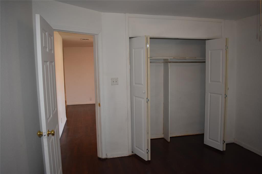 6040 Prothrow Street Fort Worth, TX 76112 - Photo 8 of 8 a view of walk in closet with empty racks