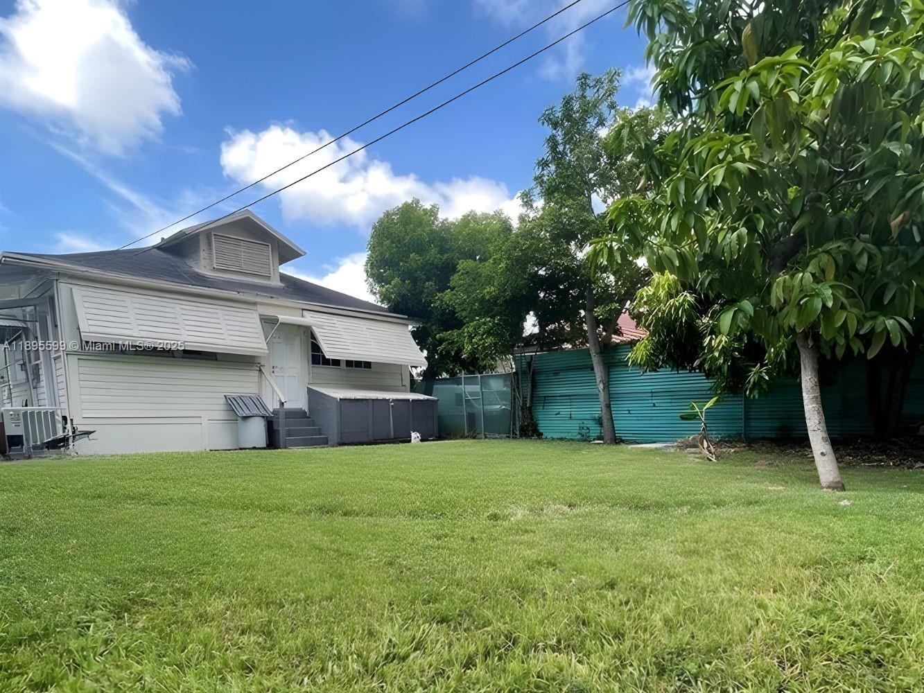 1759 Northwest 18th Terrace Miami, FL 33125 - Photo 5 of 5 a view of a house with a yard