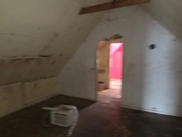 a view of a hallway with hardwood