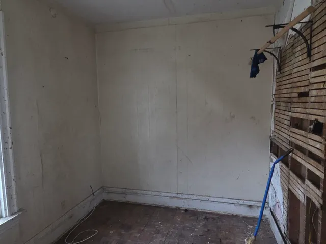 a view of storage and utility room with racks on the wall
